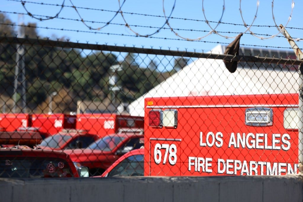More Fire fighting trucks parked in the lot, unused More Fire fighting trucks parked in the lot, unused