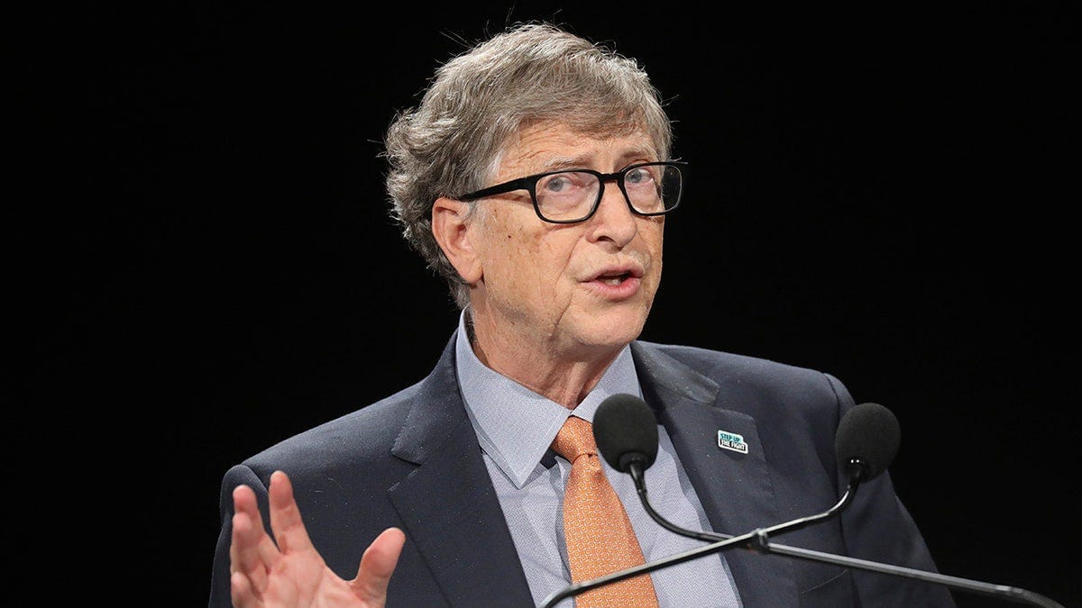 Bill Gates in light orange tie at AIDS event in France Bill Gates in light orange tie at AIDS event in France