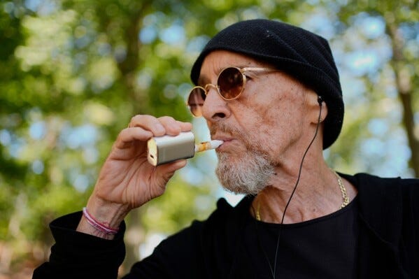 Miguel Laboy, a daily cannabis user, vapes, Friday, Oct. 3, 2025, in Brookline, Mass. (AP Photo/Robert F. Bukaty) Miguel Laboy, a daily cannabis user, vapes, Friday, Oct. 3, 2025, in Brookline, Mass. (AP Photo/Robert F. Bukaty)