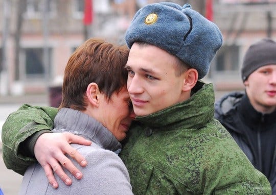 A new Russian soldier hugs his mother A new Russian soldier hugs his mother