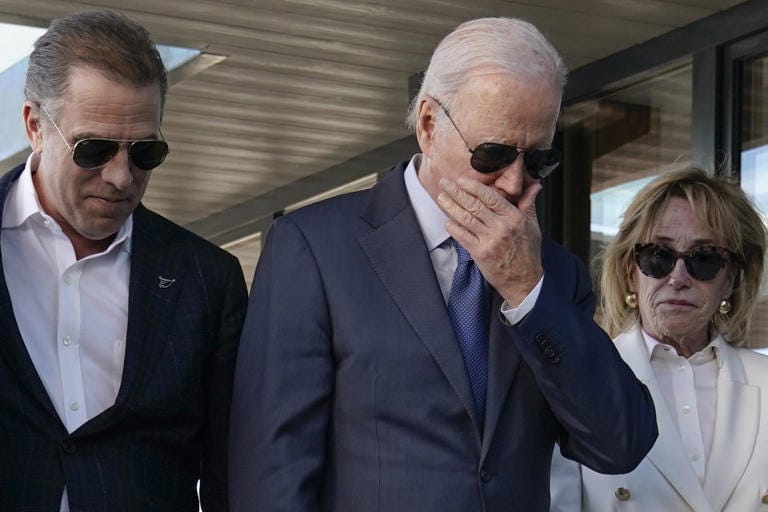 President Biden stands with his son Hunter Biden, on left, and sister Valerie Biden Owens, on right, as he looks at a plaque dedicated to his late son, Beau Biden, while visiting Mayo Roscommon Hospice in County Mayo, Ireland, on April 14. President Biden stands with his son Hunter Biden, on left, and sister Valerie Biden Owens, on right, as he looks at a plaque dedicated to his late son, Beau Biden, while visiting Mayo Roscommon Hospice in County Mayo, Ireland, on April 14.