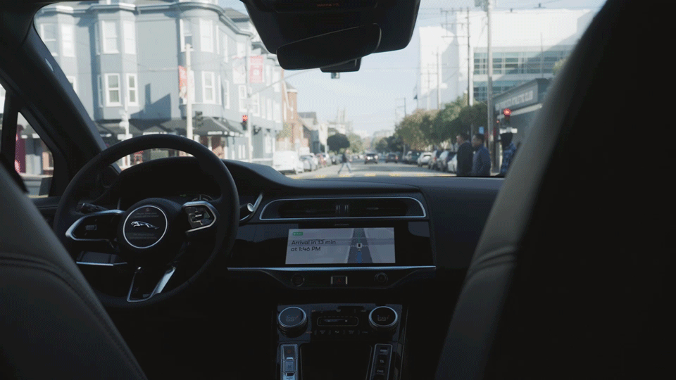 A Waymo sits at a red light in San Francisco A Waymo sits at a red light in San Francisco