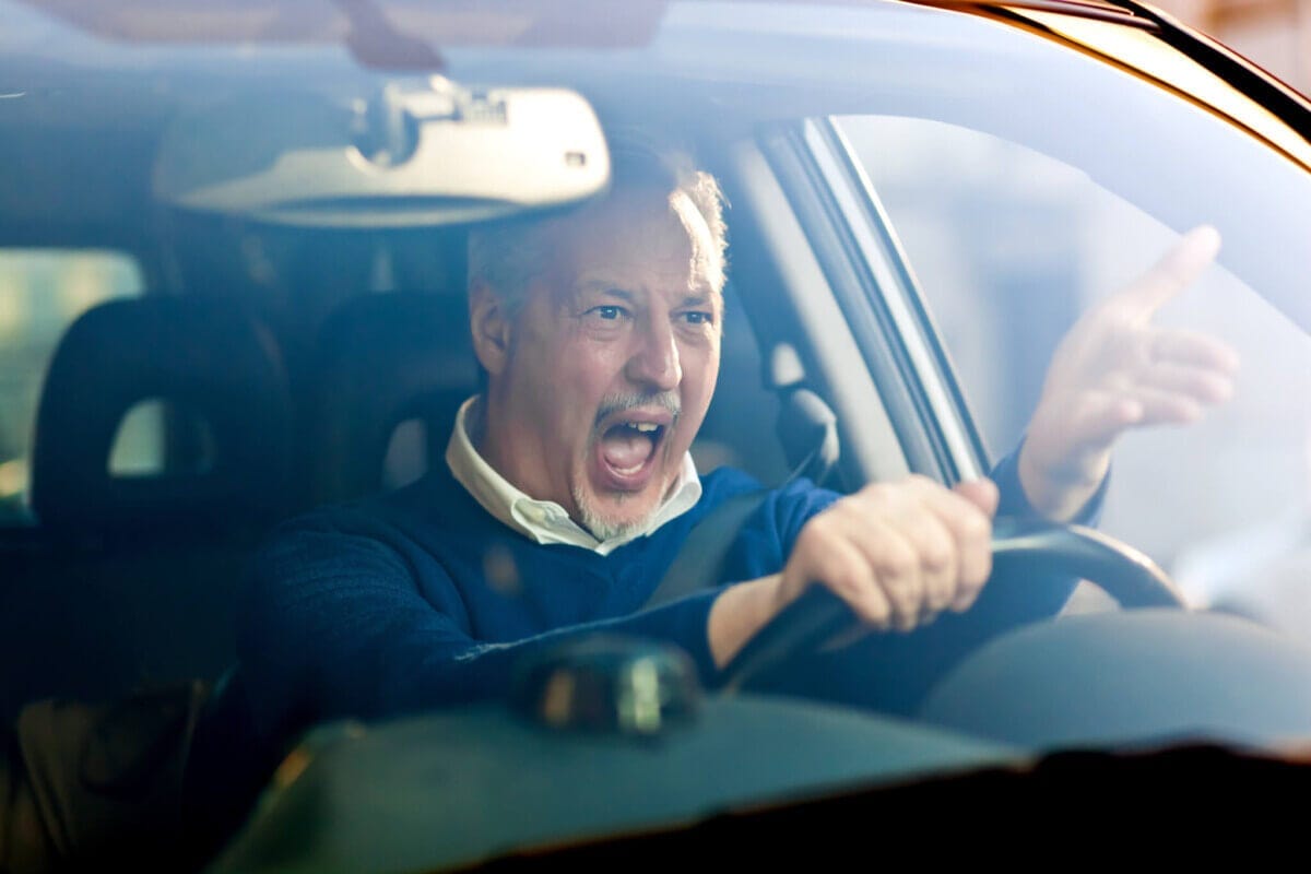 Angry, stressed driver having bad commute, road rage Angry, stressed driver having bad commute, road rage