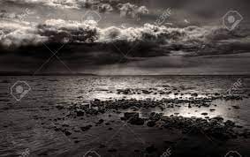 Dark Storm Clouds Gathering Over A Rocky Beach Near Homer, Alaska  Overlooking The Kachemak Bay In Black And White. Stock Photo, Picture And  Royalty Free Image. Image 13857847.