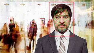 A man being recognized in a crowd by facial recognition software A man being recognized in a crowd by facial recognition software