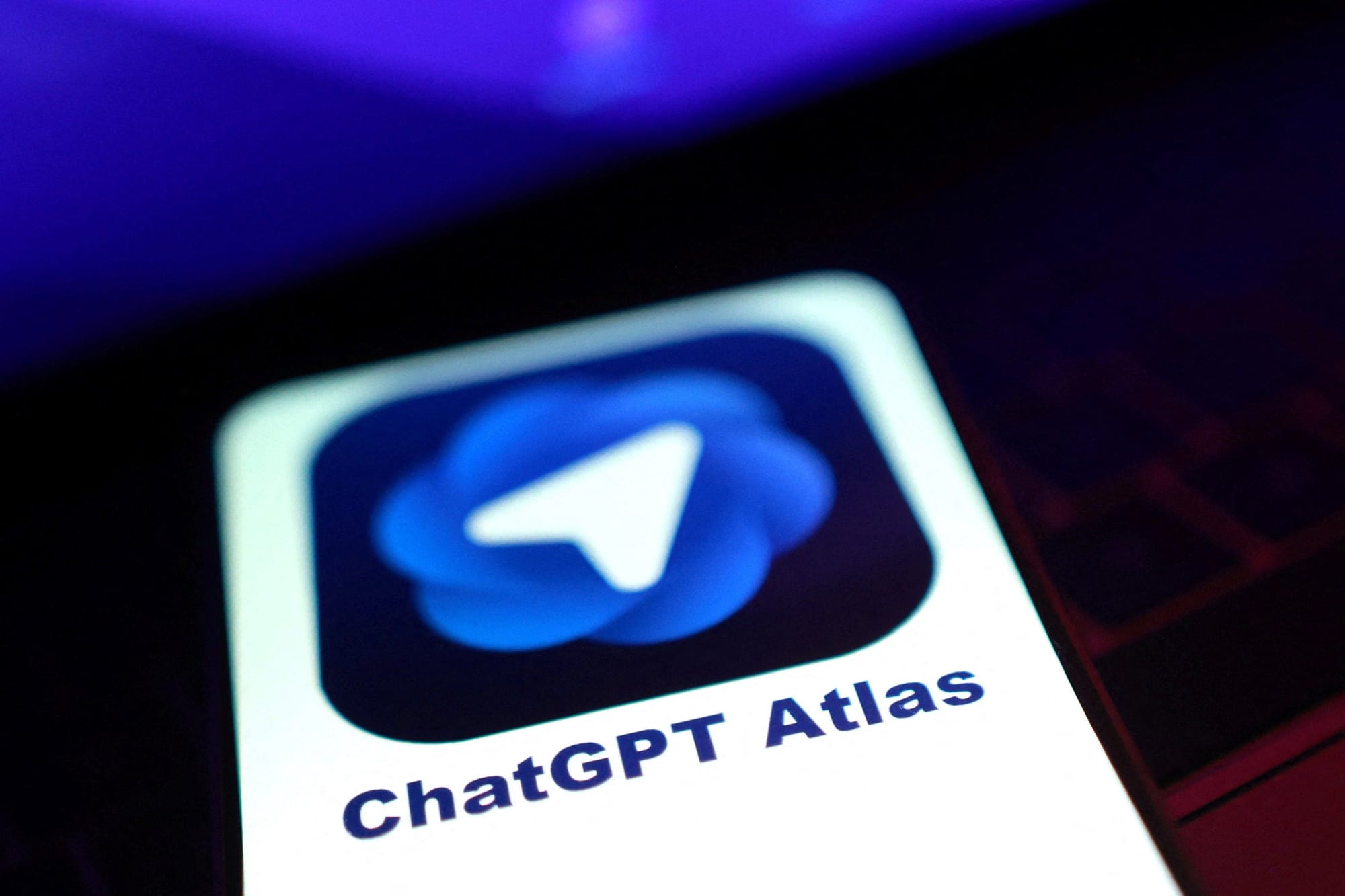 Illustration shows ChatGPT Atlas logo Illustration shows ChatGPT Atlas logo