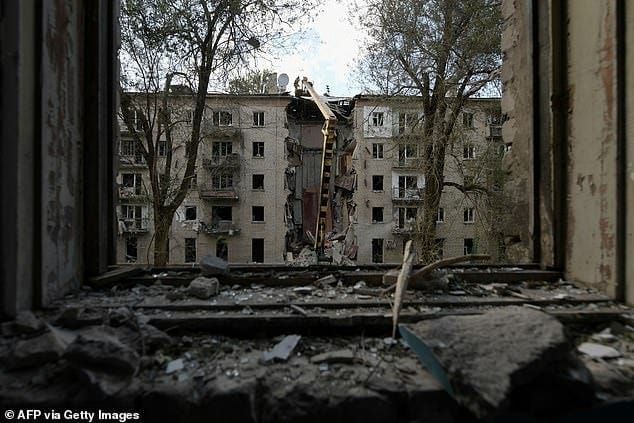 Rescuers clear the rubble of a destroyed residential building following a missile attack in Lugansk, Russian-controlled Ukraine, on June 7 Rescuers clear the rubble of a destroyed residential building following a missile attack in Lugansk, Russian-controlled Ukraine, on June 7