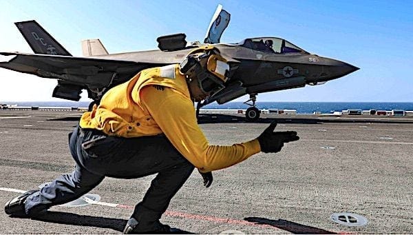 Navy Petty Officer 2nd Class Alston Adams signals to an F-35B Lightning II as it takes off from the flight deck of the USS Makin Island in the Indian Ocean, Jan. 12, 2021. (U.S. Navy photo by Petty Officer 2nd Class Kristopher S. Haley) Navy Petty Officer 2nd Class Alston Adams signals to an F-35B Lightning II as it takes off from the flight deck of the USS Makin Island in the Indian Ocean, Jan. 12, 2021. (U.S. Navy photo by Petty Officer 2nd Class Kristopher S. Haley)