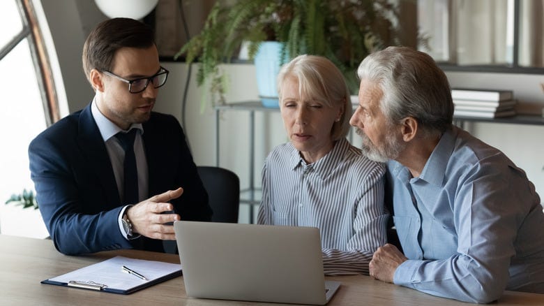 An elderly couple with an attorney