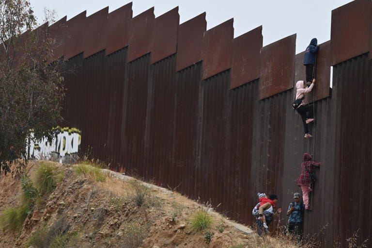 A group of adult and child migrants are smuggled at the Tijuana-San Diego border, as they climb the wall to seek asylum to the United States in Tijuana, Baja California, Mexico, on June 7, 2024. Anadolu via Getty Images A group of adult and child migrants are smuggled at the Tijuana-San Diego border, as they climb the wall to seek asylum to the United States in Tijuana, Baja California, Mexico, on June 7, 2024. Anadolu via Getty Images