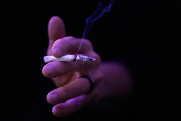 Miguel Laboy smokes a joint on Oct. 3, 2025, in Brookline, Mass. (AP Photo/Robert F. Bukaty) Miguel Laboy smokes a joint on Oct. 3, 2025, in Brookline, Mass. (AP Photo/Robert F. Bukaty)