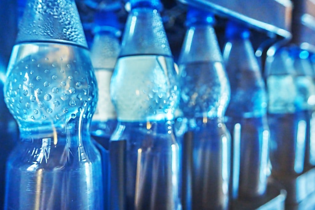 Bottled water was America’s favorite packaged drink last year, but it's also a significant source of microplastics. A row of bottled waters is shown here. Bottled water was America’s favorite packaged drink last year, but it's also a significant source of microplastics. A row of bottled waters is shown here.