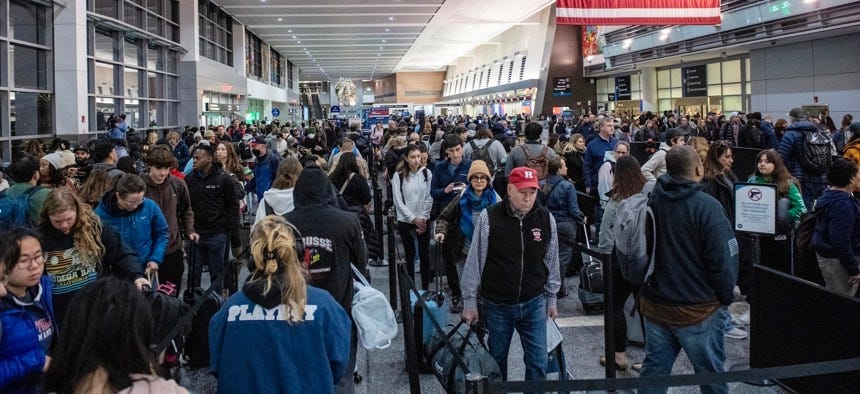 Holiday travelers crowd Boston's Logan Airport on Dec. 21, 2023. Holiday travelers crowd Boston's Logan Airport on Dec. 21, 2023.