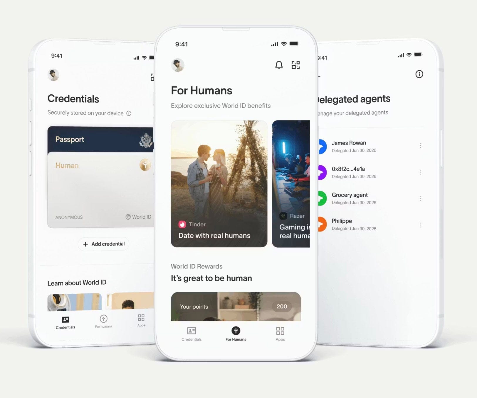 Three white smartphones showing a World ID app: credentials screen, a "For Humans" rewards feed with cards, and a delegated agents list. Three white smartphones showing a World ID app: credentials screen, a "For Humans" rewards feed with cards, and a delegated agents list.