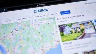 A computer screen with the Zillow website open A computer screen with the Zillow website open