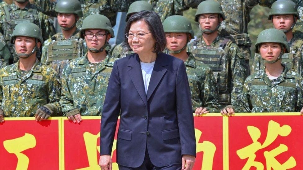 Taiwan's President Tsai Ing-wen (C) poses for photographs with combat engineer troops during a visit in Chiayi county on March 25, 2023. Taiwan's President Tsai Ing-wen (C) poses for photographs with combat engineer troops during a visit in Chiayi county on March 25, 2023.