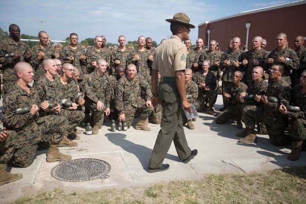 Then-Sgt. Logan Sowell, during his first tour as a Marine Corp drill instructor, does some last-minute preparation with his recruits before a test on Oct. 18, 2013, at Parris Island. Sowell returned to Parris Island to train drill instructors as a gunnery sergeant in 2020. (Lance Cpl. MaryAnn Hill/Marine Corps Recruit Depot Parris Island) Then-Sgt. Logan Sowell, during his first tour as a Marine Corp drill instructor