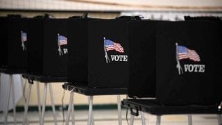 A row of voting booths A row of voting booths