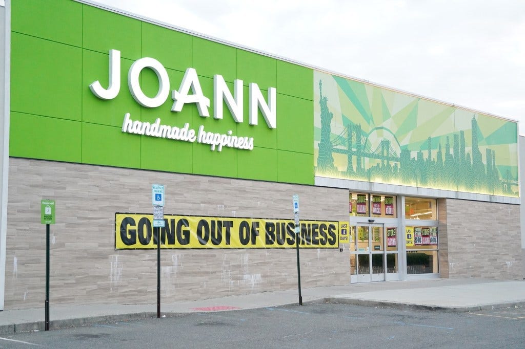 A Jo-Ann Fabrics store with a "GOING OUT OF BUSINESS" banner on its facade. A Jo-Ann Fabrics store with a "GOING OUT OF BUSINESS" banner on its facade.