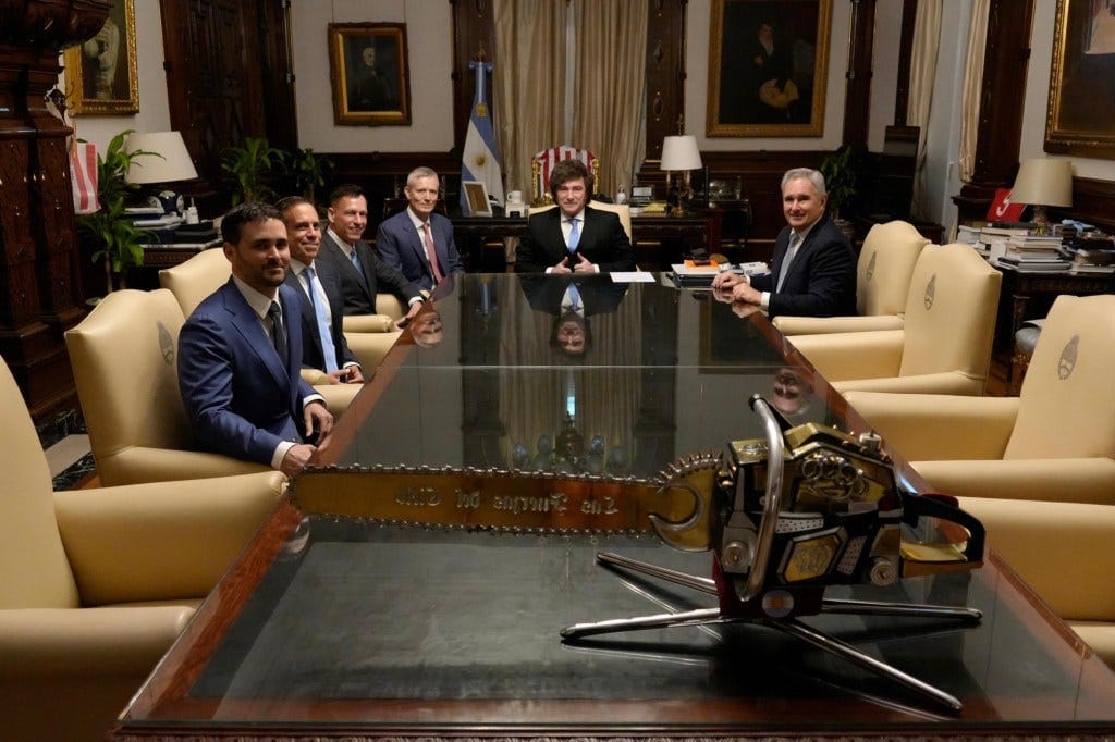 President Javier Milei (second from right) and Argentine officials welcome billionaire investor Peter Thiel (third from left) during a meeting at the Casa Rosada presidential palace in Buenos Aires last month. President Javier Milei (second from right) and Argentine officials welcome billionaire investor Peter Thiel (third from left) during a meeting at the Casa Rosada presidential palace in Buenos Aires last month.