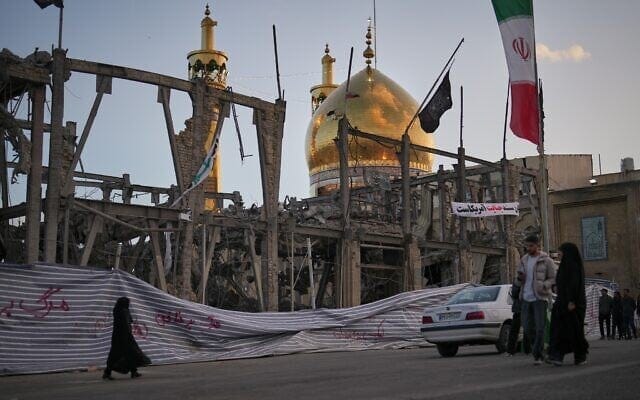 Pedetrians walk by a destroyed building within the Grand Hosseiniyeh, with the mosque visible in the background, which officials at the site say was hit by US-Israeli airstrikes in Zanjan, Iran, April 4, 2026. (AP Photo/Francisco Seco) Pedetrians walk by a destroyed building within the Grand Hosseiniyeh, with the mosque visible in the background, which officials at the site say was hit by US-Israeli airstrikes in Zanjan, Iran, April 4, 2026. (AP Photo/Francisco Seco)