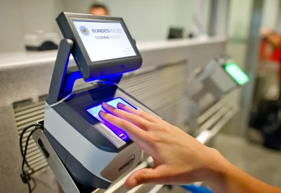 A female passenger places four fingers on a scanner of the 'Smart Border' border management system as it captures her fingerprints at the border checkpoint of the German police at the airport in Frankfurt/Main, Germany, 29 June 2015. The EU Commissi A female passenger places four fingers on a scanner of the 'Smart Border' border management system as it captures her fingerprints at the border checkpoint of the German police at the airport in Frankfurt/Main, Germany, 29 June 2015. The EU Commissi