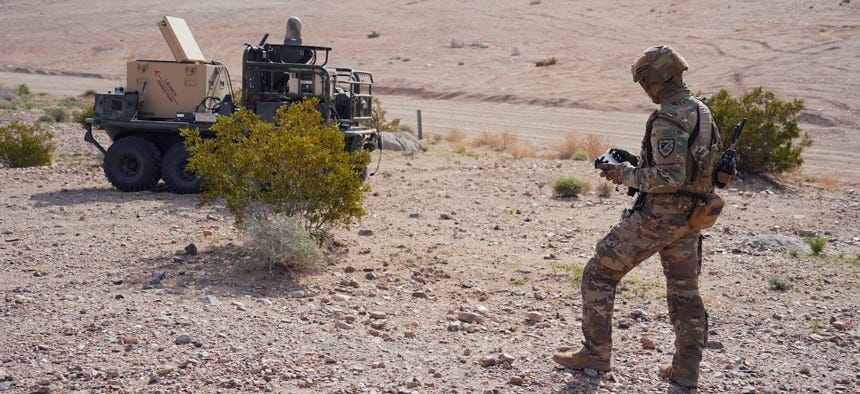 U.S. Army Pfc. Darren Campbell, infantryman assigned to the Alpha Company, 1st Battalion, 29th Infantry Regiment, 316th Cavalry Brigade, operates a ground robot during the human machine integration experiment for Project Convergence – Capstone 4 in Fort Irwin, Calif., March 11, 2024. U.S. Army Pfc. Darren Campbell, infantryman assigned to the Alpha Company, 1st Battalion, 29th Infantry Regiment, 316th Cavalry Brigade, operates a ground robot during the human machine integration experiment for Project Convergence – Capstone 4 in Fort Irwin, Calif., March 11, 2024.