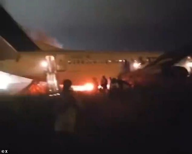 A clip taken by one horrified passenger showed a female customer sprinting away from the scene of the wreckage as flames poured from the 737's left engine, lighting up the night sky A clip taken by one horrified passenger showed a female customer sprinting away from the scene of the wreckage as flames poured from the 737's left engine, lighting up the night sky