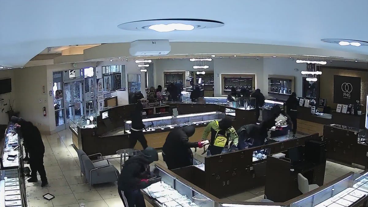 Surveillance video of smash-and-grab robbery Surveillance video of smash-and-grab robbery