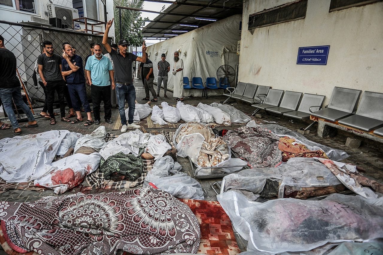 Palestinians wait to receive the bodies of their relatives who were killed in an Israeli airstrike, at Al-Najjar Hospital in Rafah, southern Gaza Strip, October 24, 2023. (Abed Rahim Khatib/Flash90) Palestinians wait to receive the bodies of their relatives who were killed in an Israeli airstrike, at Al-Najjar Hospital in Rafah, southern Gaza Strip, October 24, 2023. (Abed Rahim Khatib/Flash90)