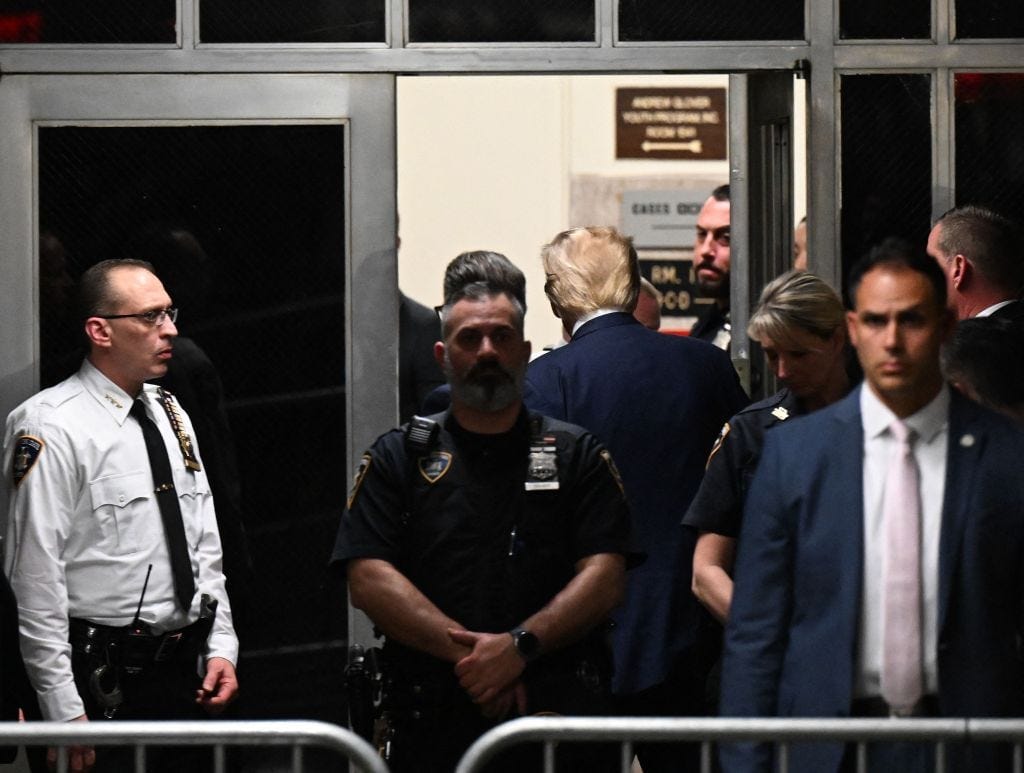 Trump leaving his hearing after getting charged. Trump leaving his hearing after getting charged.