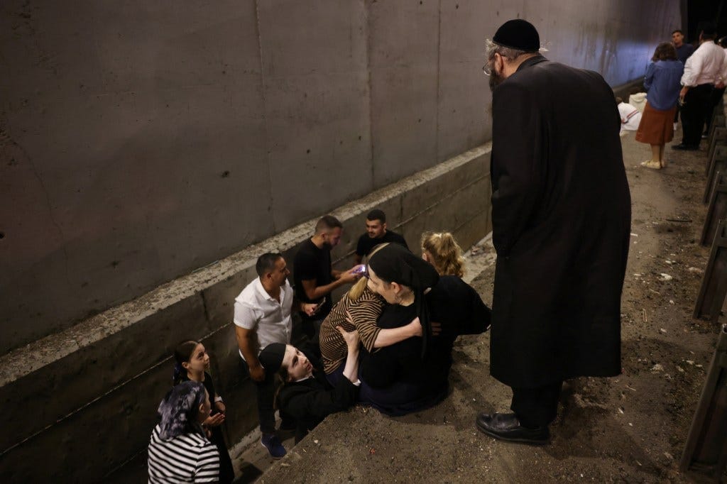 People take shelter in Israel amid the missile strikes. People take shelter in Israel amid the missile strikes.