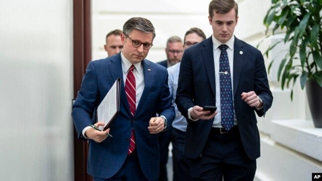 House Speaker Mike Johnson, left, arrives for a closed-door meeting with fellow Republicans at the Capitol in Washington, April 15, 2024. House Speaker Mike Johnson, left, arrives for a closed-door meeting with fellow Republicans at the Capitol in Washington, April 15, 2024.