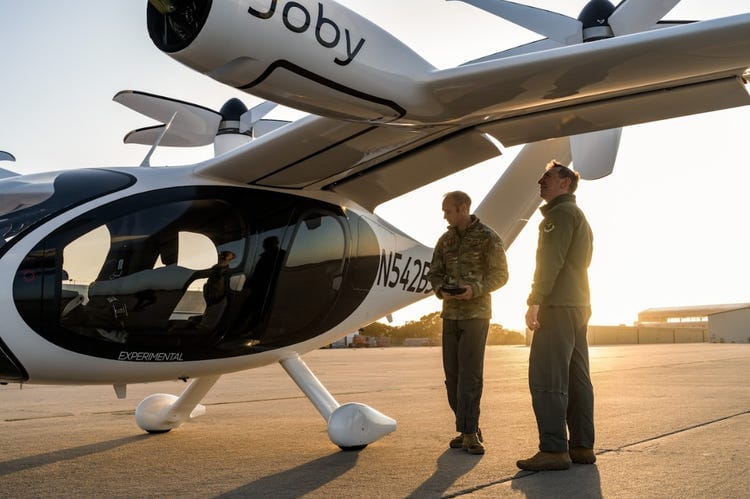 US Air Force personnel with Joby's experimental eVTOL. US Air Force personnel with Joby's experimental eVTOL.