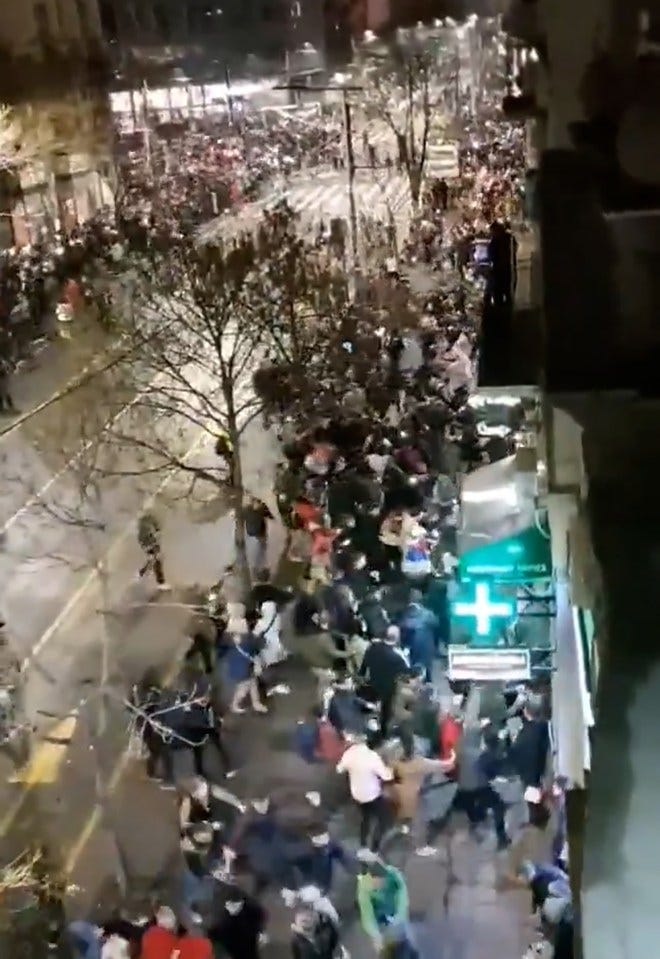 Protesters reacting to a sound during a protest in Belgrade. Protesters reacting to a sound during a protest in Belgrade.