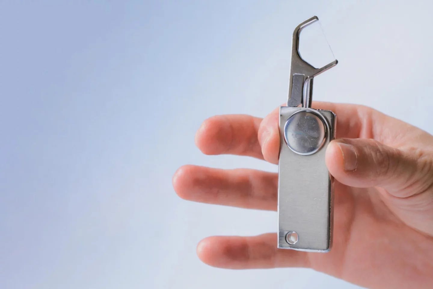 The Flossr is made from dental grade stainless steel, with a locking floss arm and a hole for a keychain The Flossr is made from dental grade stainless steel, with a locking floss arm and a hole for a keychain