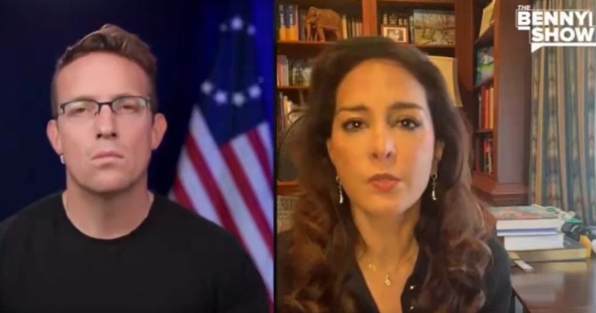 Two hosts discussing current events on The Benny Show, with a backdrop of bookshelves and an American flag. Two hosts discussing current events on The Benny Show, with a backdrop of bookshelves and an American flag.