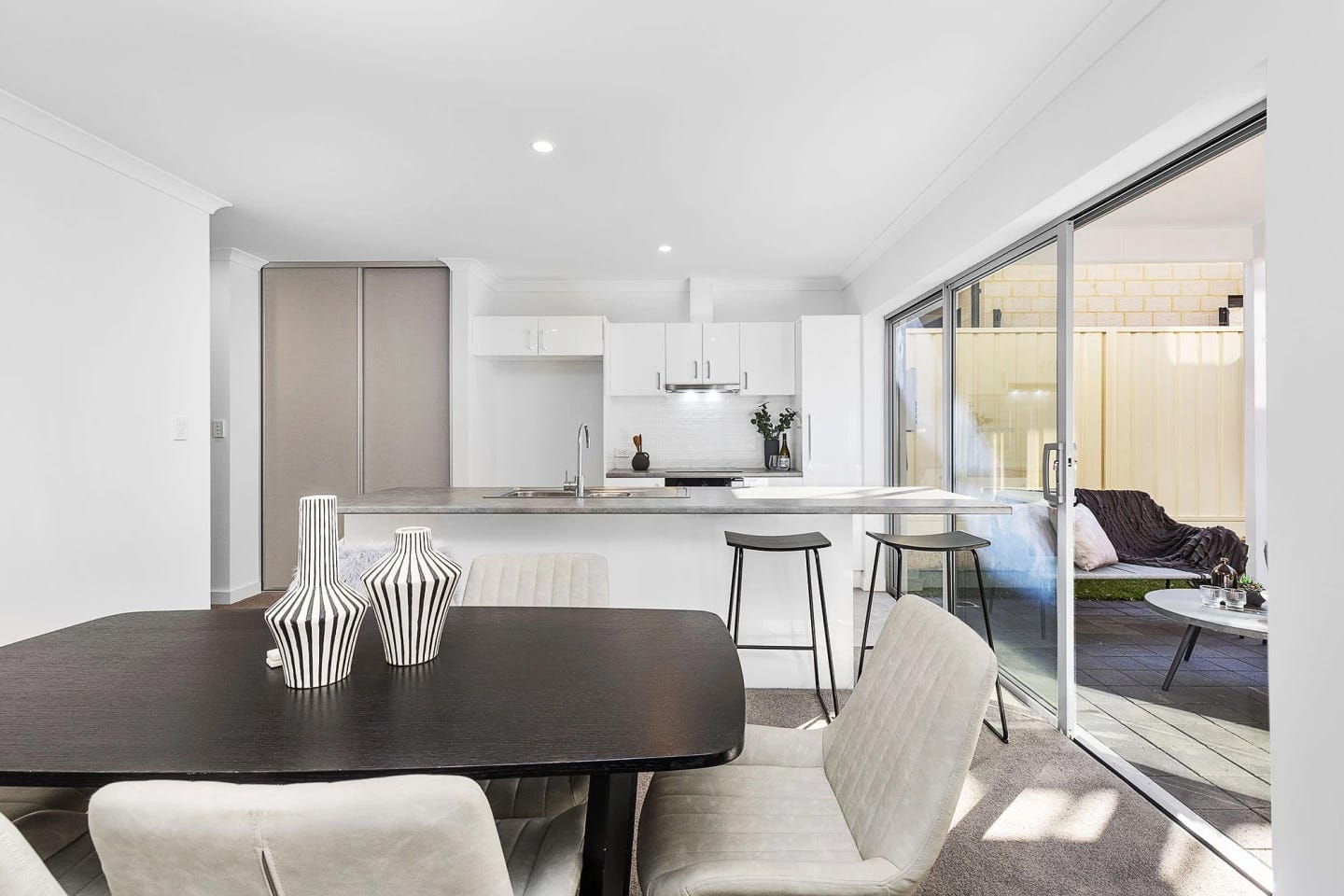 The 3D-printed house has generous glazing, helping fill the interior with daylight The 3D-printed house has generous glazing, helping fill the interior with daylight