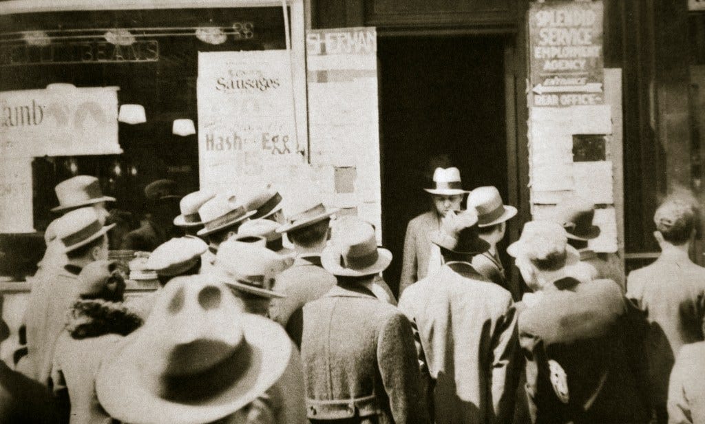Men seeking employment at a "Splendid Service Employment Agency" on Sixth Avenue, New York, during the Great Depression. Men seeking employment at a "Splendid Service Employment Agency" on Sixth Avenue, New York, during the Great Depression.