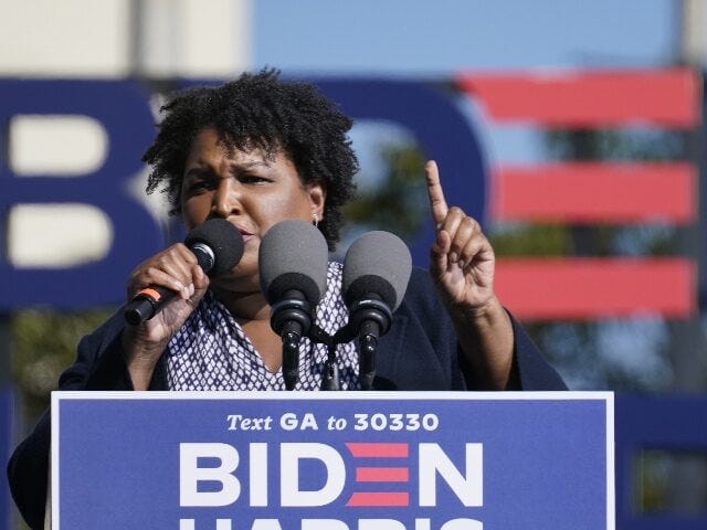 Stacey Abrams speaks to Biden supporters as they wait for former President Barack Obama to Stacey Abrams speaks to Biden supporters as they wait for former President Barack Obama to