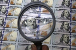 FILE - A sheet of uncut $100 bills is inspected during the printing process at the Bureau of Engraving and Printing Western Currency Facility in Fort Worth, Texas, on Sept. 24, 2013. More than $200 billion may have been stolen from two large pandemic-relief initiatives, according to a new estimates from a federal watchdog investigating federally funded programs designed to help small businesses survive the worst public health crisis in more than a hundred years. (AP Photo/LM Otero, File) FILE - A sheet of uncut $100 bills is inspected during the printing process at the Bureau of Engraving and Printing Western Currency Facility in Fort Worth, Texas, on Sept. 24, 2013. More than $200 billion may have been stolen from two large pandemic-relief initiatives, according to a new estimates from a federal watchdog investigating federally funded programs designed to help small businesses survive the worst public health crisis in more than a hundred years. (AP Photo/LM Otero, File)