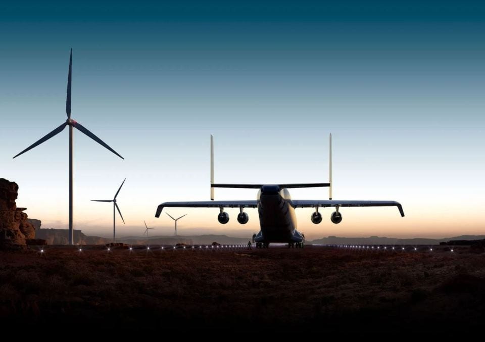 Illustration of the world's largest cargo plane, the Radia WindRunner, on a runway near wind turbines. Illustration of the world's largest cargo plane, the Radia WindRunner, on a runway near wind turbines.