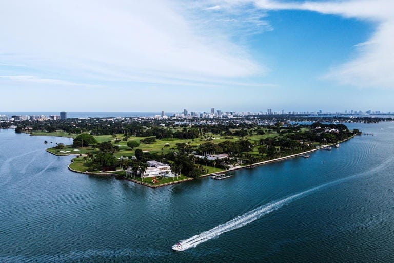 In 2014, the estimated net worth of the island's 86 residents was $37 billion. Bezos added $199 billion. Chandan Khanna/AFP via Getty Images In 2014, the estimated net worth of the island's 86 residents was $37 billion. Bezos added $199 billion. Chandan Khanna/AFP via Getty Images