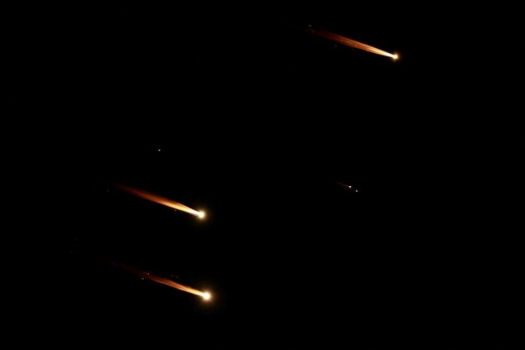Rockets fly in the sky, amid cross-border hostilities between Hezbollah and Israel. Rockets fly in the sky, amid cross-border hostilities between Hezbollah and Israel.