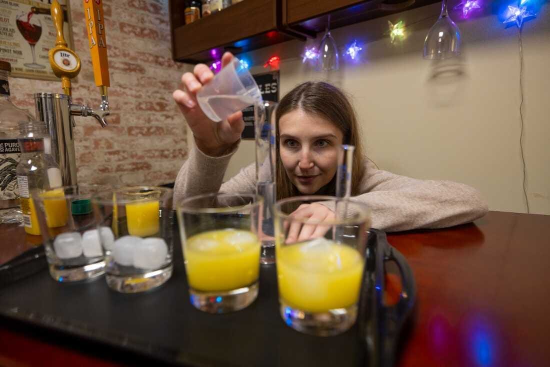 Hayley Buckey, who works in Jane Metrik's lab at Brown University measures alcohol as part of an experiment testing whether people drink less after they've smoked pot. Hayley Buckey, who works in Jane Metrik's lab at Brown University measures alcohol as part of an experiment testing whether people drink less after they've smoked pot.